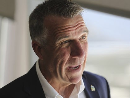 Vermont Gov. Phil Scott to a reporter before a news conference launching a Outdoors Recreation Initiative Wednesday, July 24, 2019, in Salt Lake City. Governors from about 25 states are gathering in Utah this week for the summer conference of the National Governors Association. The state leaders are expected to …