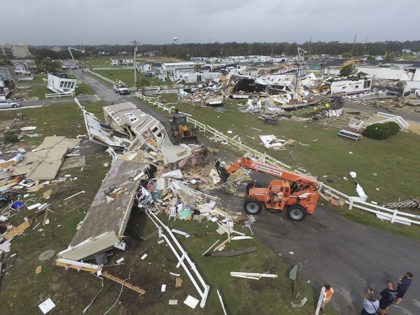 CORRECTS YEAR TO 2019-Emerald Isle town employees work to clear the road after a tornado hit Emerald Isle N.C. as Hurricane Dorian moved up the East coast on Thursday, Sept. 5, 2019. (AP Photo/Tom Copeland)