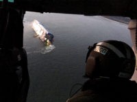 Coast Guard crews and port partners respond to a disabled cargo vessel with a fire on board Sunday, Sept. 8, 2019, in St. Simons Sound, Ga. (U.S. Coast Guard via AP)