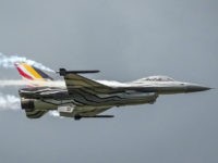 FILE - In this Wednesday, May 18, 2016 file photo, a Belgian F16 fighter jet flies over Florennes Military Airbase, in Florennes, Belgium. A Belgian F-16 fighter jet crashed Thursday, Sept. 19, 2019 on a road in western France and one of its pilots is hanging from a high-voltage electricity …
