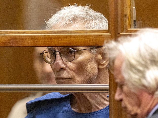 Edward Buck listens to his defense attorney Seymour Amster, right, during an appearance in Los Angeles Superior Court, Thursday, Sept. 19, 2019, in Los Angeles. The prominent LGBTQ political activist was arrested Tuesday and charged with operating a drug house and providing methamphetamine to a 37-year-old man who overdosed on …