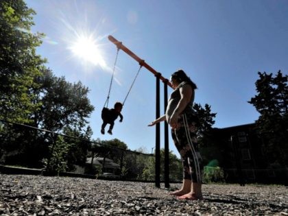 Shawnee Wilson plays with her son, Kingston, in Indianapolis, on Tuesday, Aug. 8, 2017. (Darron Cummings/AP)