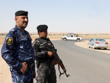 Iraqi soliders guard the Iraq-Syria border point, Albu Kamal, one of three between the two