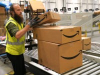 AURORA, CO - MAY 03: A worker moves packed boxes at the Amazon fullfillment center May 3, 2018 in Aurora, Colorado. The million square foot facility, employing 1,000 fulltime employees, has over 2 million products ready to ship to customers globally. (Photo by Rick T. Wilking/Getty Images)