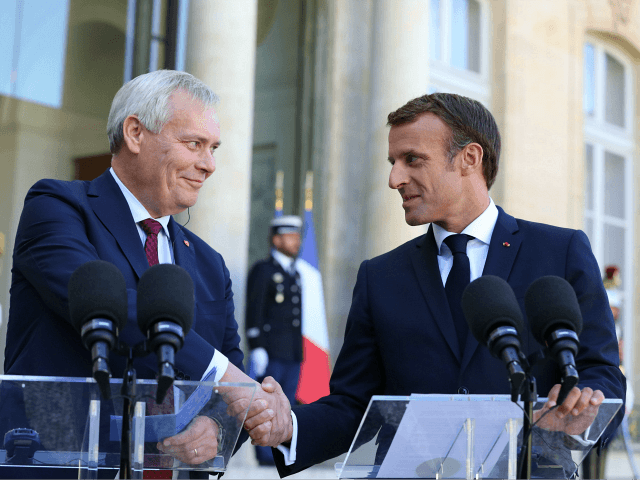 French President Emmanuel Macron shakes hands with Finnish Prime Minister Antti Rinne as they give a joint press conference following their meeting at the Elysee presidential palace on September 18, 2019, in Paris. (Photo by Ludovic MARIN / AFP) (Photo credit should read LUDOVIC MARIN/AFP/Getty Images)