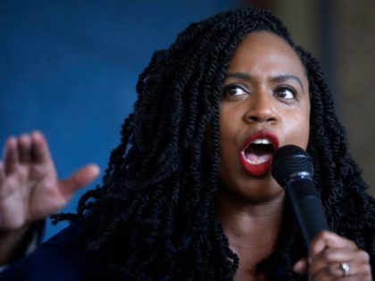 U.S. Rep. Ayanna Pressley, D-Mass., addresses a crowd during ceremonies before the start o