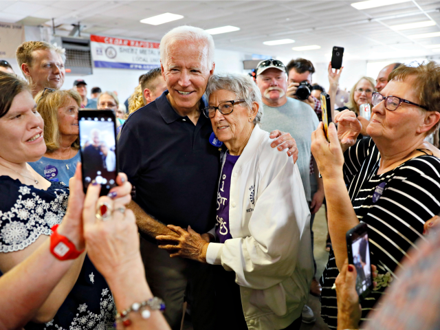 Democratic presidential candidate former Vice President Joe Biden gets a hug from Ruth Nowadzky, of Cedar Rapids, Iowa, during the Hawkeye Area Labor Council Labor Day Picnic, Monday, Sept. 2, 2019, in Cedar Rapids, Iowa. (AP Photo/Charlie Neibergall)