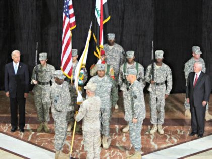 Centcom Commander General James Mattis (C) hands over the flag of the Multi-National Force Iraq to incoming commander Lieutenant General Lloyd Austin (front L) as outgoing commander General Ray Odierno (R) looks on during a Change of Command ceremony at Camp Victory in Baghdad on September 01, 2010, as US …