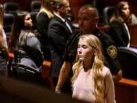 Brooke "Skylar" Richardson is escorted out of the courtroom after the verdict in her trial at Warren County Common Pleas Court Thursday, Sept. 12, 2019 in Lebanon, Ohio. The Warren County jury deliberated for four hours before acquitting Richardson of aggravated murder, involuntary manslaughter and child endangerment charges. She was …