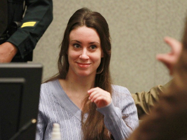 Casey Anthony smiles before the start of her sentencing hearing on charges of lying to a l