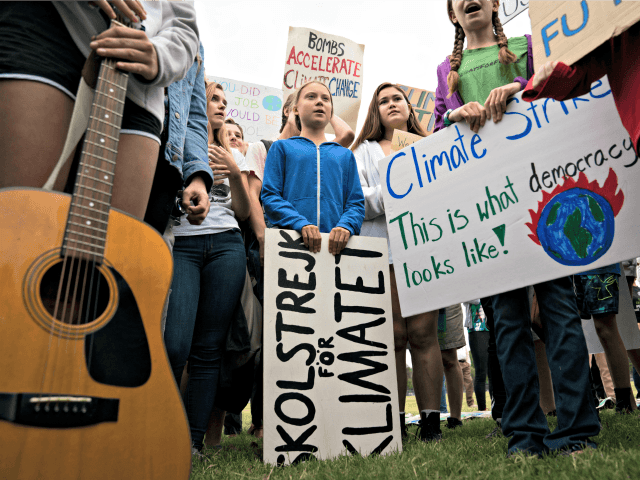 WASHINGTON, DC - SEPTEMBER 13: Teenage Swedish climate activist Greta Thunberg joins student environmental advocates during a strike to demand action be taken on climate change outside the White House on September 13, 2019 in Washington, DC. The strike is part of Thunberg's six day visit to Washington ahead of …