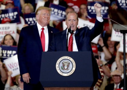 President Donald Trump, left, gives his support to Dan Bishop, right, a Republican running for the special North Carolina 9th District U.S. Congressional race as he speaks at a rally in Fayetteville, N.C., Monday, Sept. 9, 2019. (AP Photo/Chris Seward)