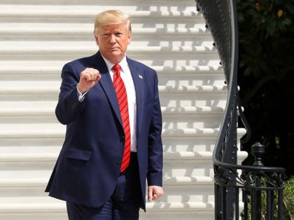WASHINGTON, DC - SEPTEMBER 26: U.S. President Donald Trump gestures as he returns to the W