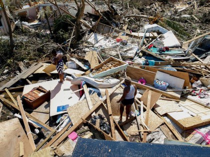 GREAT ABACO, BAHAMAS - SEPTEMBER 5: Two women look for lost items after Hurricane Dorian passed through in The Mudd area of Marsh Harbour on September 5, 2019 in Great Abaco Island, Bahamas. Hurricane Dorian hit the island chain as a category 5 storm battering them for two days before …