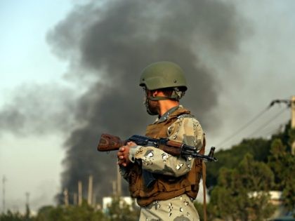 Smoke rises as angry Kabul residents set fire to part of the Green Village compound that h