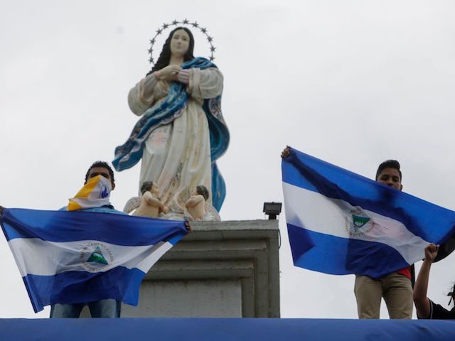 Nicaraguan Catholic faithful take part in a mass to demand the freedom of political prisoners and to cease the attack on the Catholic Church in Managua's Cathedral, in Managua on October 28, 2018. (Photo by INTI OCON / AFP) (Photo credit should read INTI OCON/AFP/Getty Images)