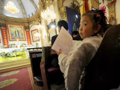 A young girl dressed as an angel attends the Christmas Eve mass at a Catholic church in Beijing on December 24, 2010. The Vatican and China have not had formal diplomatic ties since 1951, when the Holy See angered Mao Zedong's Communist government by recognising the Nationalist Chinese regime as …