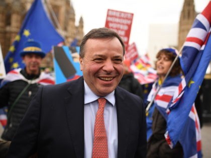 LONDON, ENGLAND - MARCH 27: Businessman and co-founder of the Leave.EU campaign, Arron Banks speaks with demonstrators outside the Houses of Parliament on March 27, 2019 in London, England. Today MPs will Vote on alternative plans for Brexit. (Photo by Leon Neal/Getty Images)