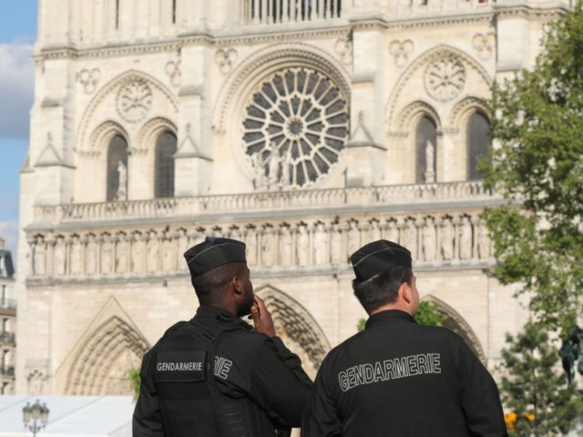 French gendarmes stand alert outside Notre-Dame de Paris Cathedral in Paris on April 29, 2