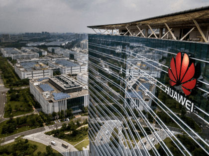 The Huawei logo is seen on the side of the main building at the company's production campus on April 25, 2019 in Dongguan, near Shenzhen, China.