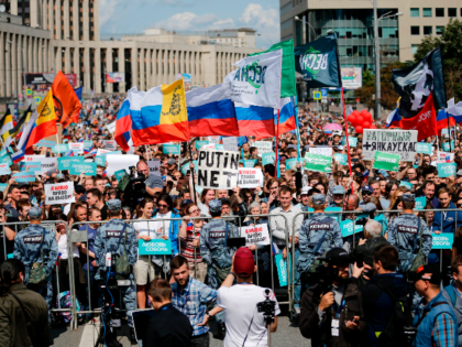 Demonstrators take part in a rally to support opposition and independent candidates after authorities refused to register them for September elections to the Moscow City Duma, Moscow, July 20, 2019. (Photo by Maxim ZMEYEV / AFP) (Photo credit should read MAXIM ZMEYEV/AFP/Getty Images)