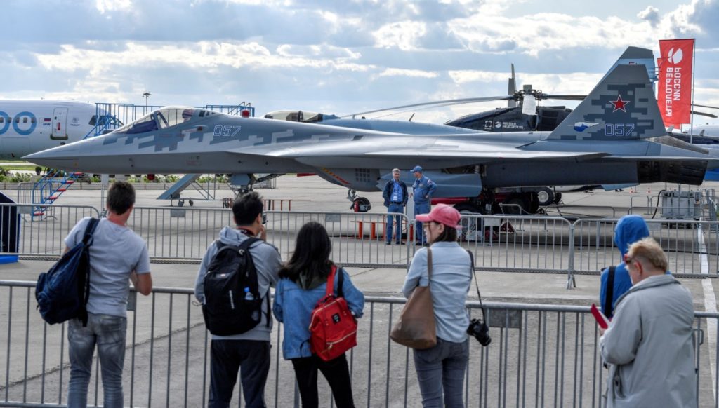 Visitors look at the Sukhoi Su-57 fifth-generation fighter during the MAKS-2019 International Aviation and Space Salon opening ceremony in Zhukovsky outside Moscow on August 27, 2019. (Photo by Alexander NEMENOV / AFP) (Photo credit should read ALEXANDER NEMENOV/AFP/Getty Images)