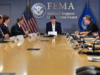 US President Donald Trump receives a briefing at the Federal Emergency Management Administ
