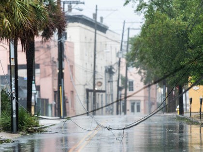 CHARLESTON, SC - SEPTEMBER 5: Downed utility lines block a street as Hurricane Dorian spins just off shore on September 5, 2019 in Charleston, South Carolina. Hurricane Dorian is now at Category 2 strength as it makes its way up the U.S. East Coast, unleashing flooding, high winds and tornadoes, …