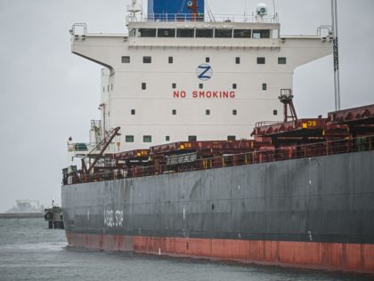 A cargo vessel carrying a shipment of coal from Mozambique with the lettering "Stop Coal" is pictured in Gdansk on September 10, 2019. - Iconic Greenpeace ship the Rainbow Warrior prevented a cargo of coal from being unloaded at Poland's port of Gdansk as activists demanded authorities end coal use …
