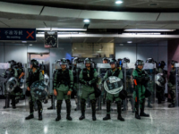 Riot police stand guard inside a train station in the Causeway Bay district of Hong Kong on September 15, 2019. - Hong Kong riot police fired tear gas and water cannons on September 15 at hardcore pro-democracy protesters hurling rocks and petrol bombs, in a return to the political chaos …