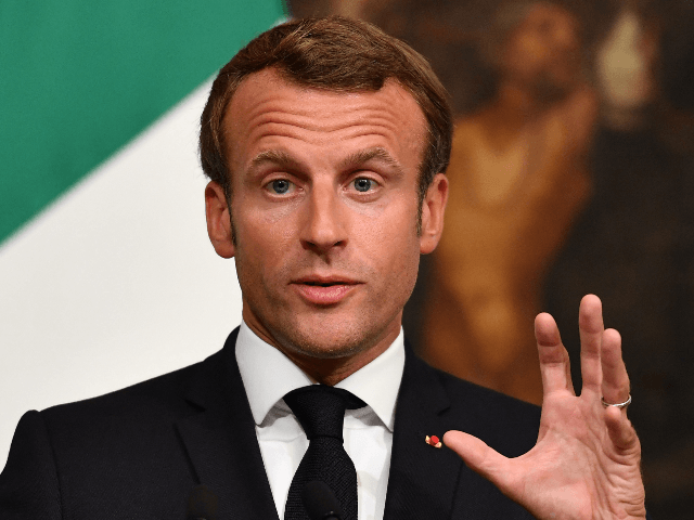 French President Emmanuel Macron gestures as he speaks during a joint press conference fol