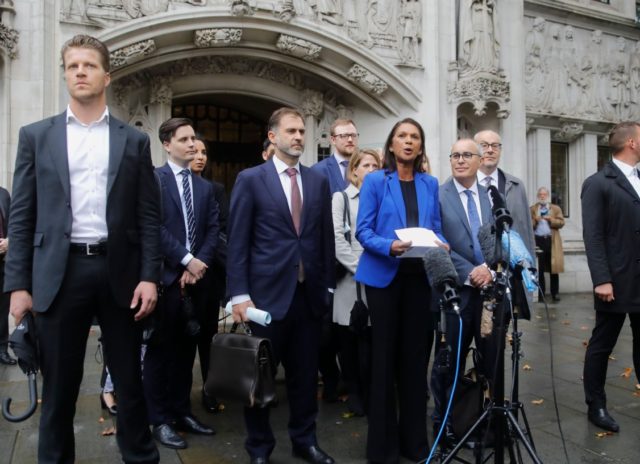 Anti-Brexit campaigner Gina Miller (C) speaks to the media outside the Supreme court in ce