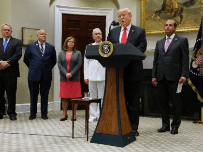 U.S. President Donald Trump (2nd R) announces the $1.8 billion State Opioid Response Grants with (L-R) Director of the White House Office of National Drug Control Policy James Carroll, Director of the Centers for Disease Control and Prevention Dr. Robert Redfield, Assistant Secretary for Mental Health and Substance Use Dr. …