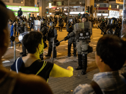 People scream at the police as they guard a street before dispersing a crowd of residents and protesters after they gathered outside the Mong Kok Police Station on September 07, 2019 in Hong Kong, China. Pro-democracy protesters have continued demonstrations across Hong Kong despite the withdrawal of a controversial extradition …