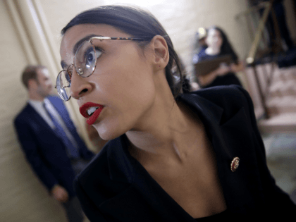 Rep. Alexandria Ocasio-Cortez (D-NY) answers questions from reporters while entering a House Democratic caucus meeting at the U.S. Capitol where formal impeachment proceedings against U.S. President Donald Trump were announced by Speaker of the House Nancy Pelosi September 24, 2019 in Washington, DC. Pelosi announced a formal impeachment inquiry after …
