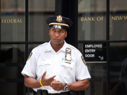 NEW YORK, NY - JULY 29: A Federal Reserve police officer stands guard outside the entrance to the Federal Reserve Bank of New York, located at 33 Liberty Street, on July 29, 2011 in New York City. Bankers and economists were invited to meet with Treasury Department officials at the …