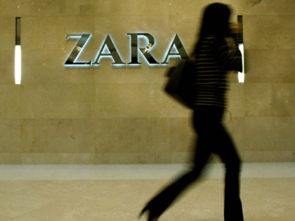 A woman walks past an outlet of the fashion chain Zara in Hong Kong, 29 November 2004. Retail sales in Hong Kong, a barometer of the health of the economy, grew 8.7 percent by value in September, boosted by car sales and tourist spending, the government said in early November. …
