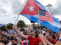 TOPSHOT - Cuban Americans in Miami's Little Havana celebrate the death of longtime Cuban leader Fidel Castro on November 26, 2016. Cuba's socialist icon and father of his country's revolution Fidel Castro died on November 25 aged 90, after defying the US during a half-century of ironclad rule and surviving …