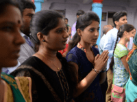 Indian Hindu devotees offer prayers to Lord Balaji, known as the 'Visa God', at the Chilkur Balaji Temple in Rangareddy district, some 30 kms from Hyderabad, on April 29, 2017.