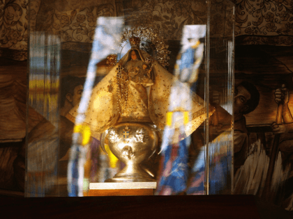 A replica statue of the 400-year-old "La Virgen de la Caridad del Cobre" is on display in the National Shrine of Our Lady of Charity August 6, 2006 in Miami, Florida. Built in 1966, the shrine houses a replica of the 400-year-old statue of Virgin of Charity and is a …