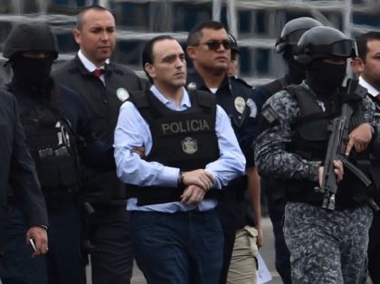 The former governor of the Mexican state of Quintana Roo, Roberto Borge (C) is escorted by the police during his extradition to Mexico, at Panama City's Tocumen international airport on January 4, 2018. Panama extradited former Mexican state governor Roberto Borge to Mexico to face charges of alleged graft, the …