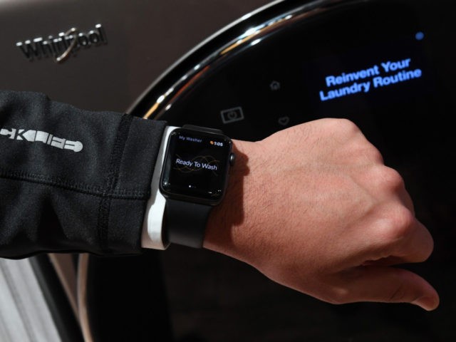 LAS VEGAS, NV - JANUARY 09: An Apple Watch is displayed in front of a new USD 1,699 Whirlpool All-In-One Washer and Dryer at the Whirlpool booth during CES 2018 at the Sands Expo and Convention Center on January 9, 2018 in Las Vegas, Nevada. The washer-dryer syncs up notifications …