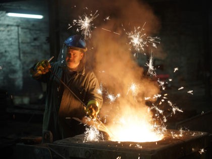 WALSALL, ENGLAND - FEBRUARY 21: Furnace man Paul Taylor tends the iron furnace at Kirkpatr