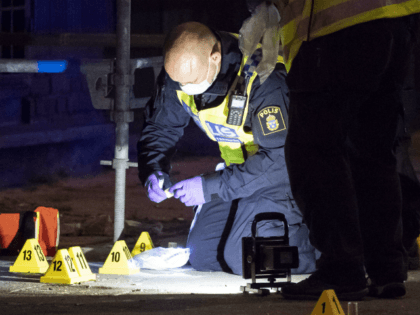 Policemen search the scene after five people were hurt in a shooting in the centre of the southern Swedish city of Malmo on June 18, 2018. - One person was killed and five wounded in a shooting in the centre of the southern Swedish city of Malmo, police said, ruling …