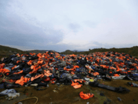 FILE - In this Thursday, March 16, 2017 file photo, piles of life jackets used by refugees and migrants are left in Molyvos village, on the northeastern Greek island of Lesbos. About 1,500 asylum-seekers were being transported from Greece's eastern Aegean island of Lesbos to the mainland Monday Sept. 2, …