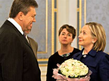 US ecretary of State Hillary Rodham Clinton smiles with Ukraine President Viktor Yanukovyc