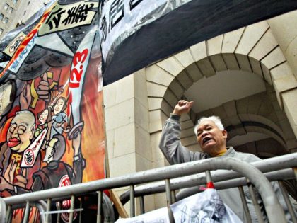 HONG KONG, CHINA: A elderly flat owner shout slogans during the 11th day of a protest against a court verdict and calling for public support, in front of the Legco in Hong Kong, 02 February 2005. In a move that could fundamentally change liability laws in Hong Kong, the High …