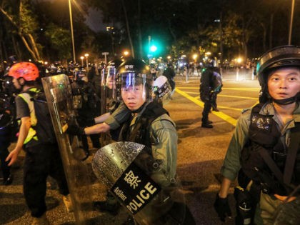 Riot police push back the press as they isolate and search protesters in Causeway Bay in H