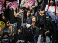 Demonstrators hold up their opened palms with five fingers, signifying the five demands of protesters, as they march from Chater Garden to the US consulate in Hong Kong on September 8, 2019, to call on the US to pressure Beijing to meet their demands and for Congress to pass a …