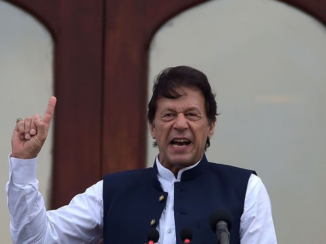 Pakistan's Prime Minister Imran Khan addresses the nation outside the Prime Minister Secretariat building in Islamabad on August 30, 2019. - Prime Minister Imran Khan vowed to continue fighting for Kashmir until the disputed Himalayan territory was "liberated" as thousands rallied across Pakistan on August 30 in mass demonstrations protesting …